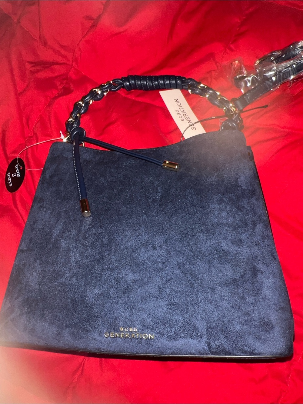BCBG GENERATION Navy bag with gold tone beautiful handle and comes w/cross strap